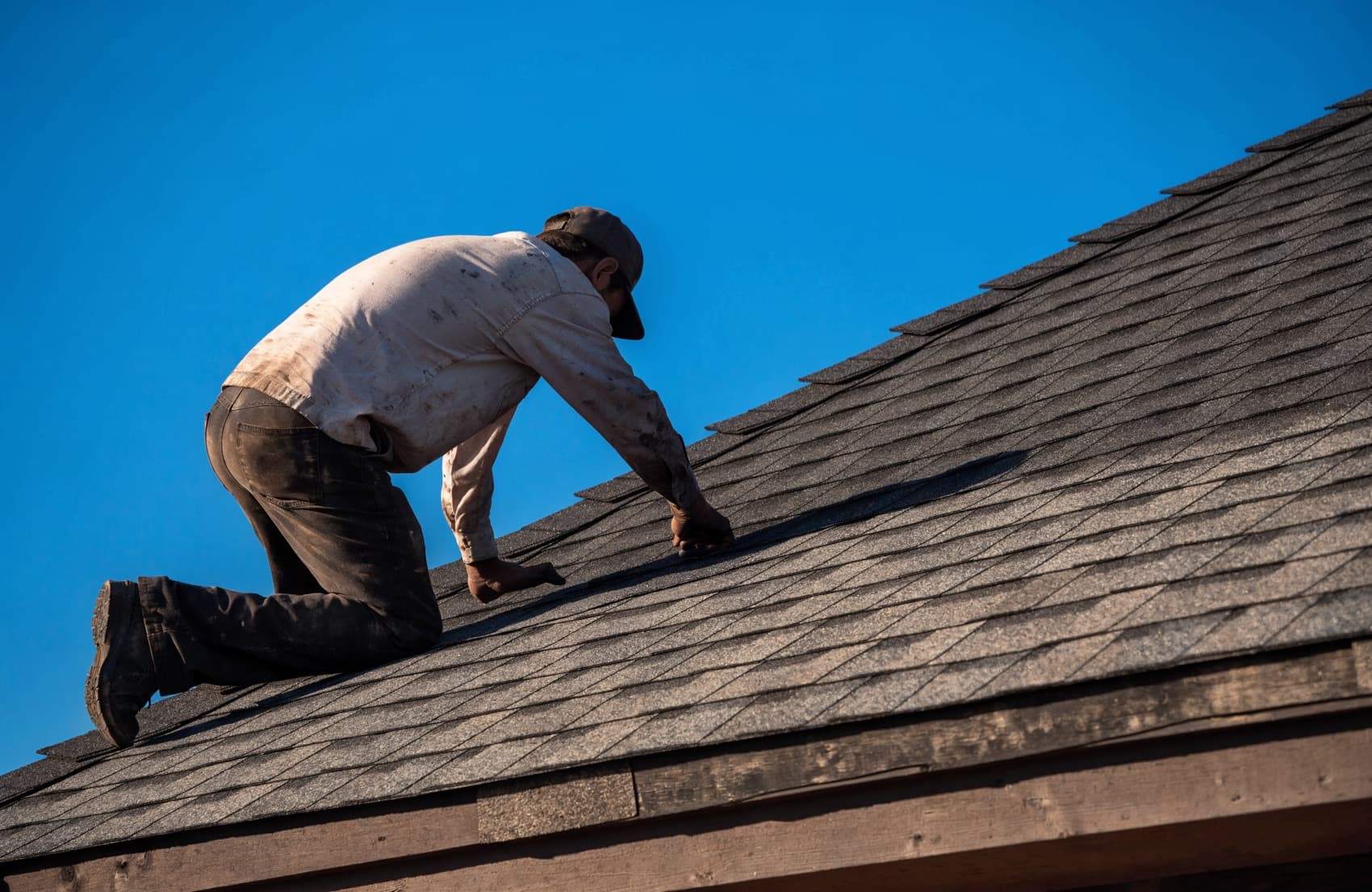 A roofer on the job after generating exclusive roofing leads